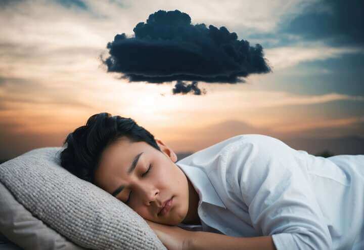 A person sleeping peacefully while a dark cloud hovers over their head